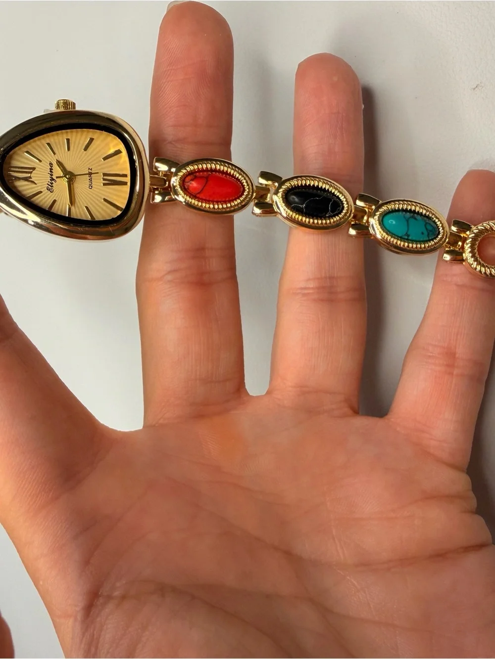 Gold Teardrop Dial Bracelet Watch with Red, Black and Turquoise Accents